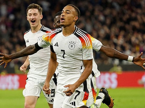 Germany midfielder Jamie Leweling celebrates after scoring the opening goal with his teammates during the Uefa Nations League match against the Netherlands in Munich on Monday.