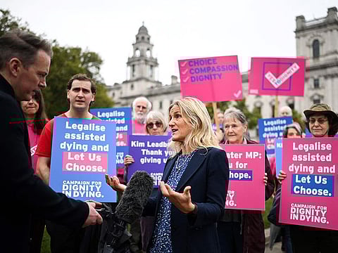 Labour MP Kim Leadbeater speaks to the press during a gathering in favour of the proposal to legalise euthanasia in the UK, called by campaigners from "Dignity in Dying", outside The Palace of Westminster, home to the Houses of Parliament in central London, on October 16, 2024.