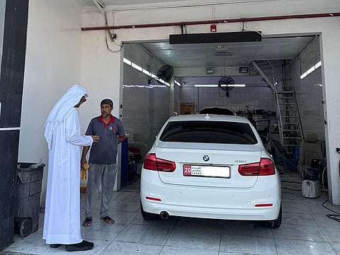 An Abu Dhabi City Municipality inspecting a car workshop in the capital.