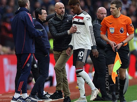 Manchester United's English striker Marcus Rashford with Dutch manager Erik ten Hag during the English Premier League football match against Aston Villa at Villa Park in Birmingham, central England on October 6.