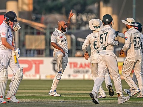 Pakistan's Sajid Khan celebrates with teammates after taking the wicket of England's Harry Brook during the second day of the second Test cricket match at the Multan Cricket Stadium in Multan.