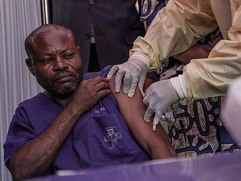 A clinician administers the mpox vaccine to a hospital staff member during the launch of the vaccination campaign at the General Hospital of Goma, Democratic Republic of Congo, on October 5, 2024.
