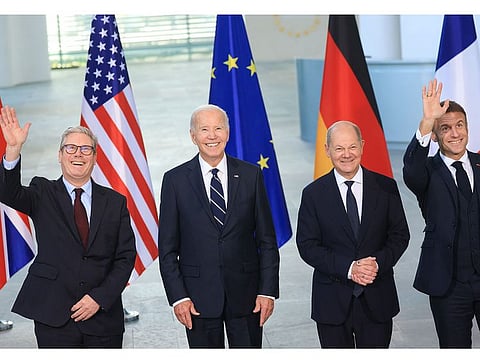 Keir Starmer, UK prime minister, US President Joe Biden, Olaf Scholz, Germany's chancellor, and Emmanuel Macron, France's president, left to right, during a family photo session in Berlin, Germany, on Friday, Oct. 18, 2024.