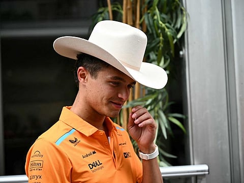 McLaren's British driver Lando Norris wears a cowboy hat in the paddock ahead of the United States Grand Prix at the Circuit of the Americas in Austin, Texas.