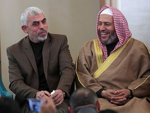Yahya Sinwar (L) the Hamas leader in the Gaza Strip and senior political leader of the Islamist movement Khalil Al Haya attend the opening of a new mosque in Rafah town in the southern Gaza Strip on February 24, 2017.