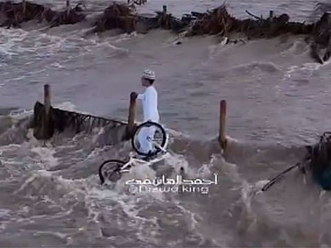 Omani boy becomes local hero after rescuing bicycle from torrential floodwaters.