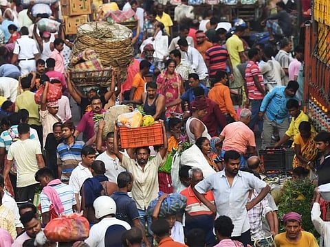 Traders at a wholesale vegetable market in Kolkata.