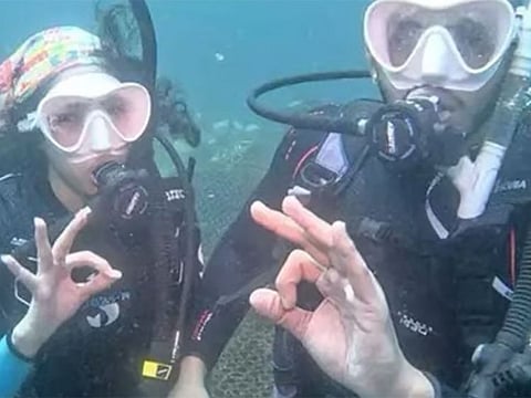 Saudi couple makes a splash with underwater wedding.