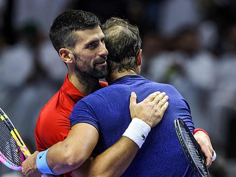 Serbia's Novak Djokovic and Spain's Rafael Nadal embrace after their third-place tennis match in the "6 Kings Slam" exhibition tournament in Riyadh on Saturday.
