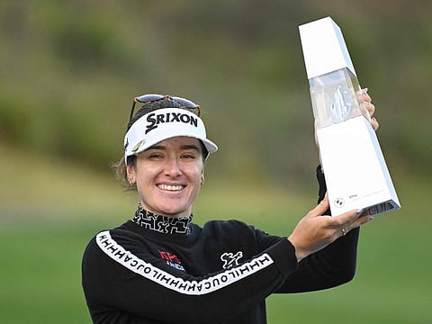 Hannah Green of Australia poses with the champion's trophy after her victory at the end of the 2024 BMW Ladies Championship golf tournament at Seowon Valley Country Club in Paju on Sunday.