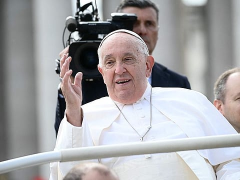 Pope Francis waves from his popemobile after the weekly Angelus prayers, at the Saint Peter's Square in the Vatican on October 20, 2024.