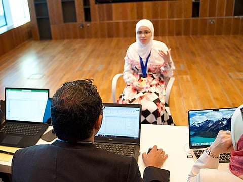 A participant answering to judges of the contest