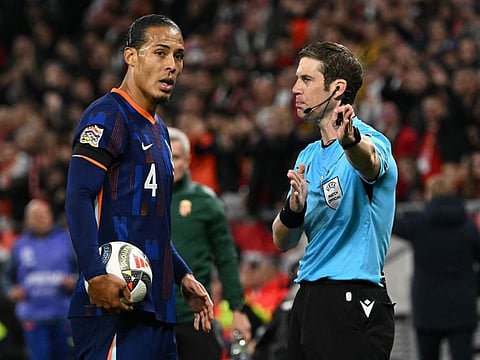 Netherlands' defender Virgil van Dijk is sent off by the Swiss referee Lukas Faehndrich reacts during the Uefa Nations League, League A Group A3 football match.