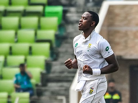 South Africa's Kagiso Rabada celebrates after taking the wicket of Bangladesh's Mushfiqur Rahim during the opening day of the first Test in Dhaka on Monday.