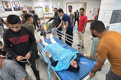A wounded Palestinian woman is brought for treatment at the Kamal Adwan Hospital after an Israeli airstrike in Beit Lahia, in the northern Gaza Strip on October 19, 2024. On Thursday, UN investigators said Israel was deliberately targeting health facilities in Gaza, and killing and torturing medical personnel there, accusing the country of “crimes against humanity”.