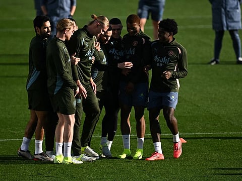 Manchester City's Norwegian striker Erling Haaland (centre) and teammates take part in a training session at Manchester City's training ground in Manchester, north-west England, on Tuesday.