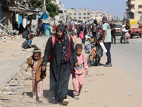 Displaced Palestinians fleeing Israeli military operations in Beit Lahia in the northern Gaza