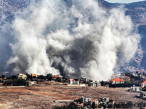 Smoke rises following an Israeli air strike on the village of Khiam in southern Lebanon near the border with Israel.