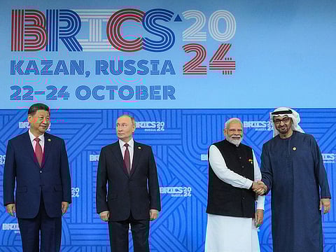 UAE President Sheikh Mohamed bin Zayed Al Nahyan shakes hands with Indian Prime Minister Narendra Modi during the BRICS family photo, at Kazan Expo Centre, BRICS Summit venue, in Kazan on Wednesday. Russian President Vladimir Putin and Chinese President Xi Jinping are also present.