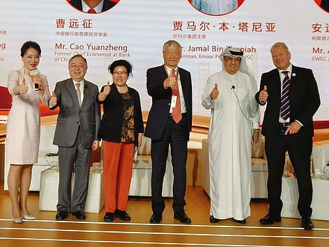 Chinese businessman Ronnie Chan (2nd L) and other panelists during the event on Wednesday