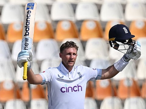 England's Joe Root celebrates after scoring his double century in the first Test against Pakistan in Multan on October 10.
