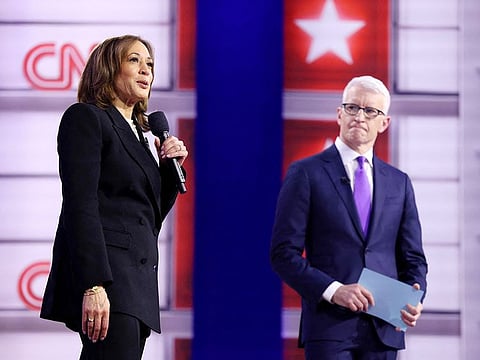 US Vice President and Democratic presidential candidate Kamala Harris speaks as she replies to a question from an attendee during a CNN Town Hall moderated by television host Anderson Cooper (R) at Sun Center studios in Aston, Pennsylvania, on October 23, 2024.