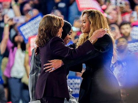 Recording artist Beyonce (L) speaks as Kelly Rowland (R) looks on during a campaign rally with Democratic presidential candidate, U.S. Vice President Kamala Harris, at Shell Energy Stadium on October 25, 2024 in Houston, Texas.