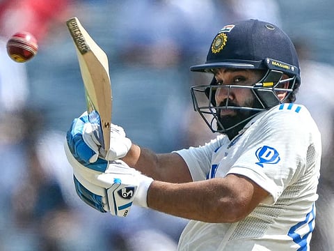 India's captain Rohit Sharma plays a shot during the third day of the second Test match against New Zealand at the Maharashtra Cricket Association Stadium in Pune on October 26, 2024.