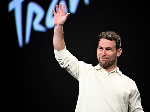 British cyclist Mark Cavendish waves as he arrives on stage for the 2025 Tour de France and the 2025 Tour de France Femmes (women) routes' presentation in Paris on Tuesday.