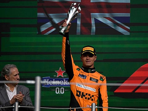 McLaren's British driver Lando Norris, who celebrates with the runner-up trophy in Mexico City Grand Prix on Sunday, has managed to reduce the gap at the top with ace rival Max Verstappen.