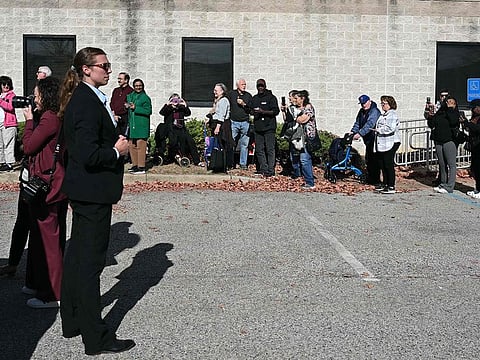 People wait in line to cast their early-voting ballots in the 2024 general election in New Castle, Delaware, October 28, 2024.