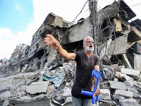 A man reacts amid the destruction a day after Israeli airstrikes that targeted the southern Lebanese city of Nabatieh on October 17, 2024. Mustafa Ahmad Shahadi, who served as the deputy head of Radwan, was killed in a strike carried out by fighter jets in southern Lebanon’s Nabatieh.