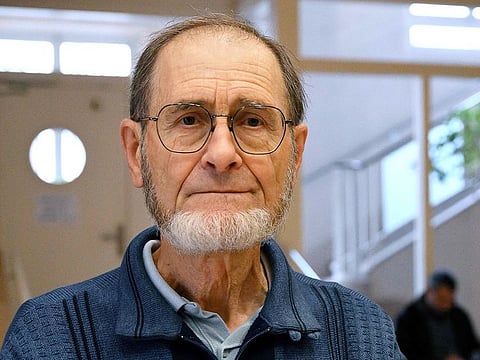 Defendant Bernard Pallot pose as he attends a hearing in his trial over the murder of his seriously sick wife, whom he claims to have killed at her request to relieve her suffering, at the Aube Assizes Court in Troyes, eastern France, on October 30, 2024.