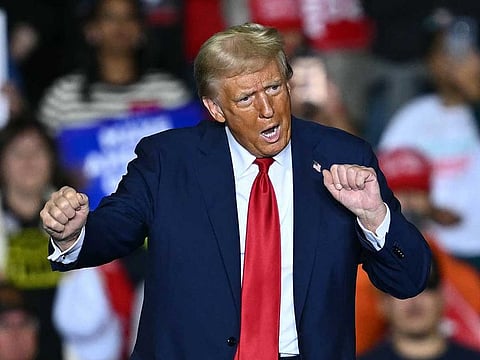 Former US President and Republican presidential candidate Donald Trump dances onstage after his speech during a campaign rally at the PPL Center in Allentown, Pennsylvania, on October 29, 2024.