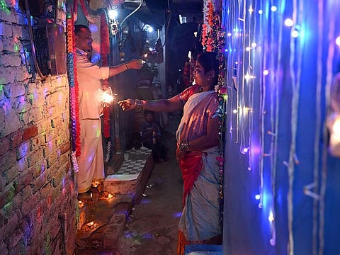 People light firecrackers during the celebrations to mark Diwali, the Hindu festival of lights, in New Delhi on October 31, 2024.