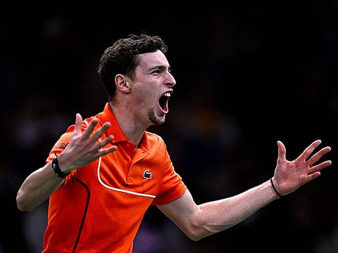 France's Ugo Humbert celebrates after defeating Spain's Carlos Alcaraz in their men's singles round of 16 at Paris Masters on Thursday.