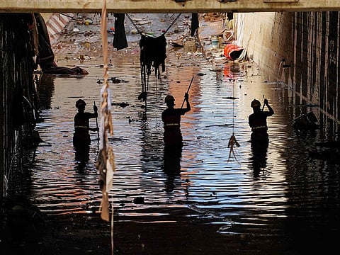 Firefighters search for bodies amongst the debris on November 2, 2024, in the aftermath of deadly floods in the town of Alfafar, in the region of Valencia, eastern Spain.