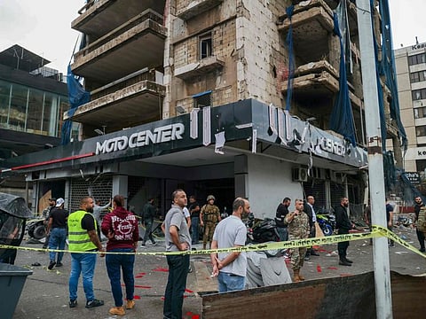 Lebanese army soldiers secure the area outside a building that was targeted in an Israeli airstrike in Beirut's southern suburbs on November 2, 2024.