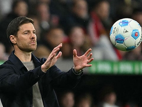 Bayer Leverkusen's Xabi Alonso catches the ball during a match. The Spanish head coach is eager to return to his favoured turf when the German team take on Liverpool in Champions League clash on Tuesday.