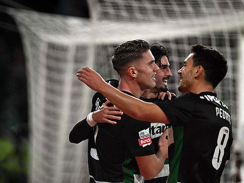 Sporting Lisbon's Swedish forwardViktor Gyokeres (L) celebrates scoring the opening goal during the Portuguese League football match between Sporting CP and CF Estrela da Amadora at the Jose Alvalade stadium in Lisbon, on November 1, 2024.