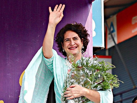 Congress General Secretary and candidate for Wayanad by-elections, Priyanka Gandhi Vadra waves to the crowd during the corner meeting in Wayanad on Tuesday. (ANI Photo)