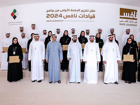 His Highness Sheikh Mohammed bin Rashid Al Maktoum, Sheikh Mansour bin Zayed Al Nahyan, Sheikh Hamdan bin Mohammed bin Rashid Al Maktoum, Sheikh Maktoum bin Mohammed bin Rashid Al Maktoum, and Lieutenant General Sheikh Saif bin Zayed Al Nahyan with the graduates on Monday in Abu Dhabi