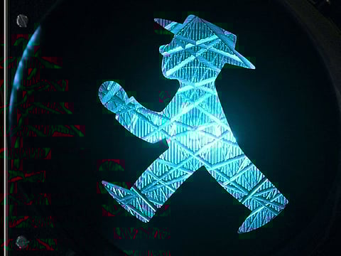 The little man with hat in the traffic light has transformed into an improbable symbol of reunified Germany.