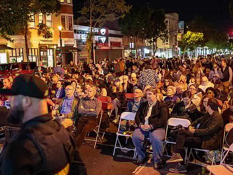 People watch results in the U.S. presidential election at a watch party in the Mission District on November 5, 2024 in San Francisco, California