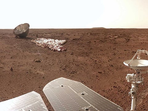 This handout picture taken on July 12 and released on July 15, 2021 by the China National Space Administration (CNSA) shows an image of China's Zhurong Mars rover's parachute and backshell taken by the rover from a distance of 30 meters on the surface of Mars.