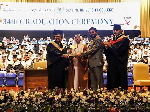 Kamal Puri, Founder, Skyline International Group and Board Member of Skyline University College, Nitin Anand, Vice-Chairman of Skyline International Group and Board Member, Skyline University College, and Prof. Mohammad In'airat, Vice Chancellor, Skyline University College, presented a commemorative souvenir to the Chief Guest, Sheikh Khalid Bin Isam Bin Saqer Al Qassimi, Chairman of the Department of Civil Aviation in Sharjah, at the 34th Graduation Ceremony.