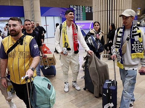 Fans of the Israeli football club Maccabi Tel Aviv arrive at the Ben Gurion International Airport on the outskirts of Tel Aviv on November 8, 2024, upon returning from Amsterdam.