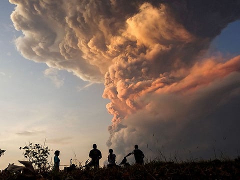 At least seven international flights from Indonesia's resort island Bali have been cancelled, an airport official said Friday, after a volcano in the archipelago nation's east erupted, shooting dark ash eight kilometres into the sky and forcing thousands to evacuate.