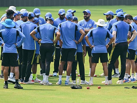 India's captain Rohit Sharma stands in a team huddle during a practice session ahead of their third Test cricket match against New Zealand, at the Wankhede stadium in Mumbai on October 30.