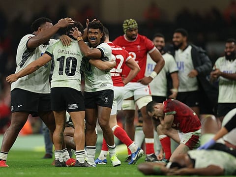 Fiji's players celebrate their win after the Autumn Nations Series International rugby union test against Wales at the Principality Stadium, in Cardiff on Sunday.
